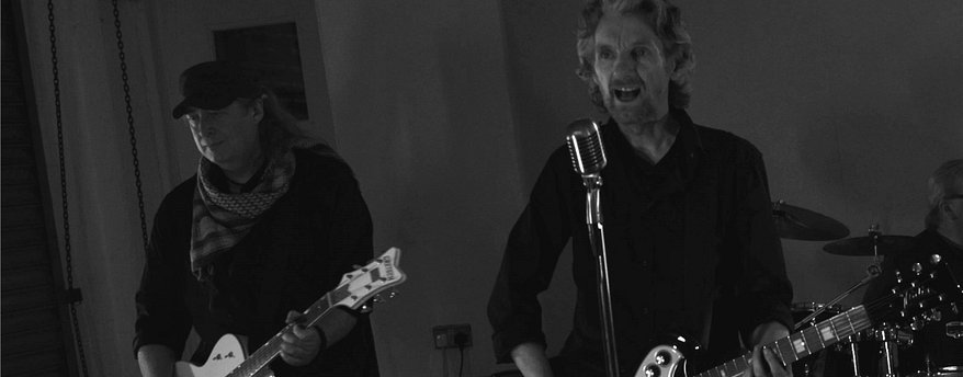 Andy Newey - guitars, Tony Barrett Powell - vocals, rhythm guitar.jpg